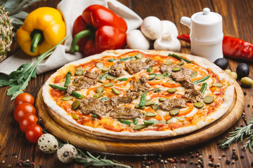 Pizza with beef meat and vegetables