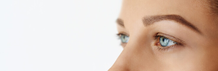 Fototapeta premium Femal face with blue eyes without make-up