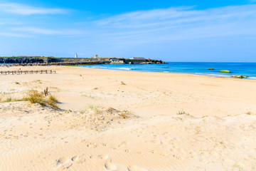 Sand dunes on beach in Tarifa town, Spain