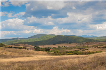 Cloudy landscape of the Pirin Mountain over the village of Hadjidimovo Bulgaria.