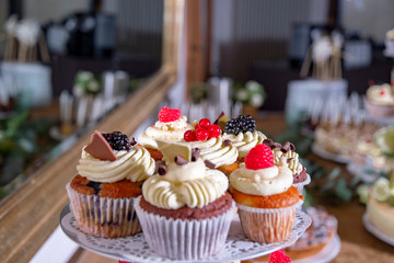 cupcakes with fruits at sweet table buffet