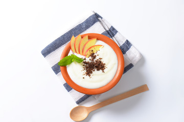 Semolina or rice pudding with apple and chocolate