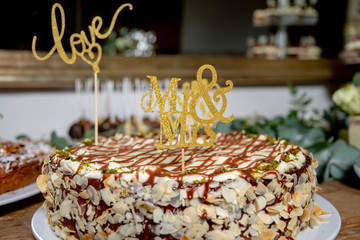 homemade cake with sticker love and mr and mrs to the wedding