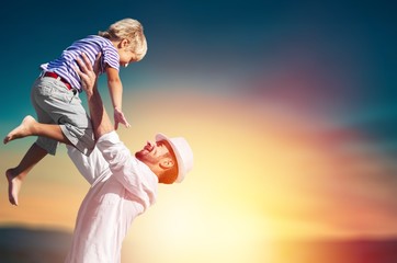 Family happy outside sunset vacation lifestyle hug