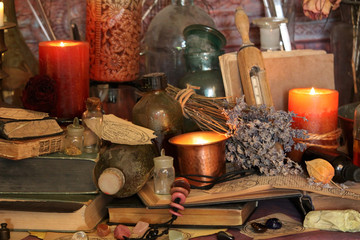 Antique Magic Book. Witchcraft Peacock feathers and candle background. Black candle Magic Ritual.