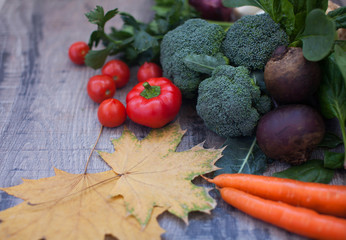 Vegetables on vintage wood background - autumn harvest. Rural still life from above with free text space.