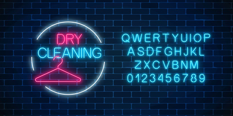 Neon dry cleaning glowing sign with hanger in circle frame with alphabet. Cleaning service signboard design.