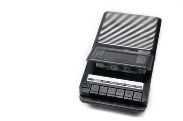 Old-time desktop type cassette recorder on white isolated background