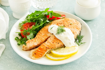 grilled salmon steak with cream sauce.