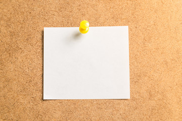 white sticker for notes on a cardboard background