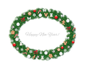 Christmas wreath oval frame decorated with gingerbread cookies, balls and snowflakes.