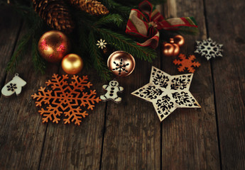 christmas and new year card with tree decorations/wooden figures of houses,snowflakes on the blue rustic background