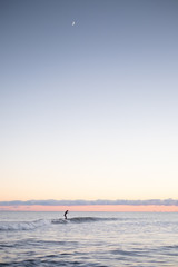 Fototapeta premium Surfing under the moon