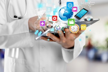 Man holding   digital tablet on background