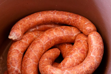 Raw homemade sausage with paprika before fumigation