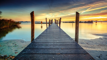 Architecture built walkway on the water with perspective, view art and calm water at sunny sunset - 232195635