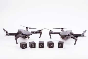 Flying drones lie on a white background. Theme selling and buying drone.