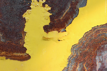 Yellow rusted metal sheet with shadow