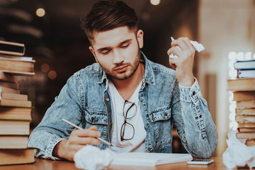 Student Studying at Desk in University Library