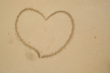 Fototapeta na wymiar Hearts on the beach in the sand at bedruthan cornwall england uk 