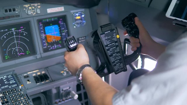 A pilot steers a wheels, close up.