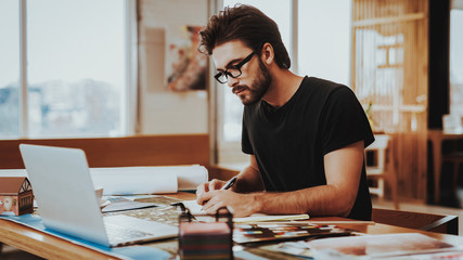 Graphic Designer Concentrated on Work Project