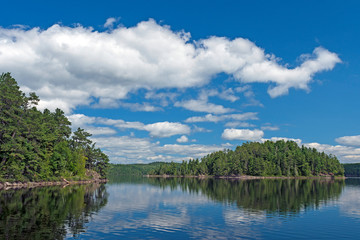 Puffy Clouds in Summer on a North Woods Lake
