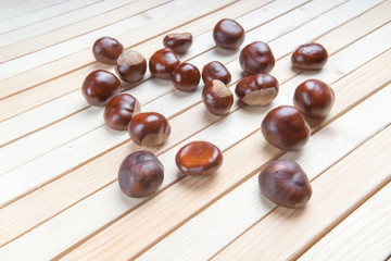Horse Chestnut for Christmas on wooden background