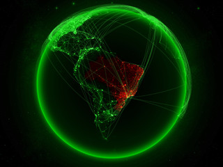 Brazil from space on planet Earth with green network representing international communication, technology and travel.
