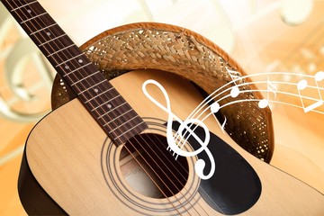 Acoustic guitar with straw hat