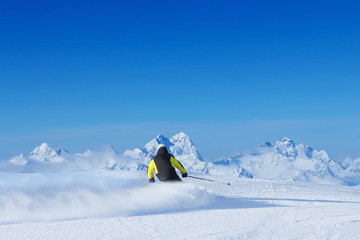 Skier in high mountains