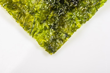 nori chips on a white ceramic plate, seaweed sheets © Wingedbull