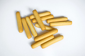 Delicious bread sticks on white background.
