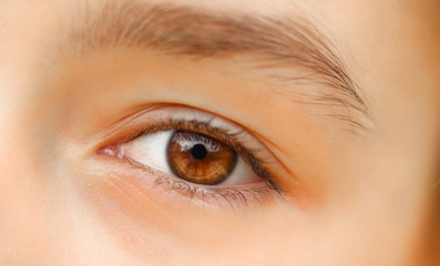 Obraz premium Close-up shot of beautiful brown eye of little girl with reflection. No make up. Naturality concept