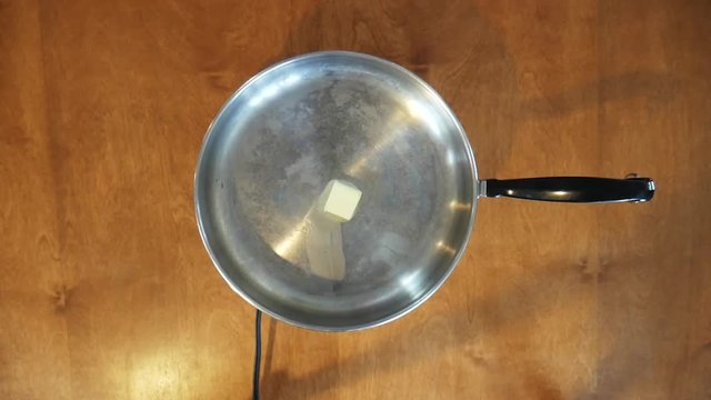 Frying haddock in pan, close up