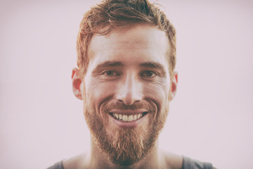 Obraz premium Smiling young happy man with beard - Hairstyle, hipster hair style bearded handsome healthy model.