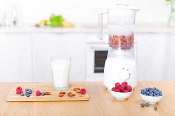 Preparing detox fruits smoothie in blender
