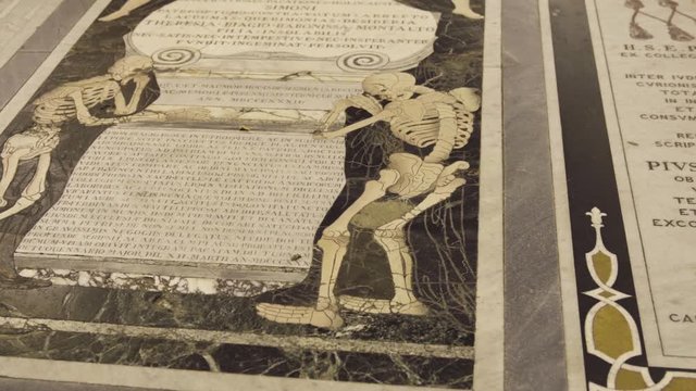 Skeleton on tombstone in Malta cathedral, close up