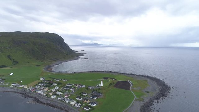 Lush coastal town in Europe, wide aerial