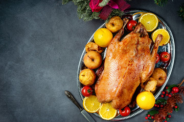 Christmas roasted whole goose on rustic table