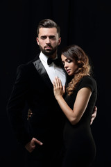 portrait of fashion couple on black background