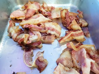 Top view of fried bacon on tray in restaurant, fried meat 