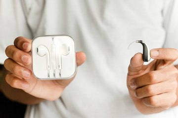 Hearing aid and earphone. The concept of hearing care.