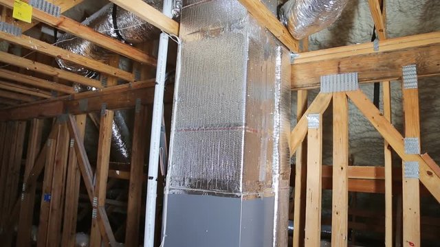 home construction with installation of heating system on the roof of the pipe system of heating close up