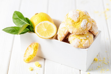 Lemon cookies on white wooden box, on white background