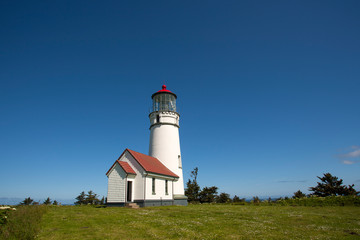 Fototapeta na wymiar lighthouse on coast of sea