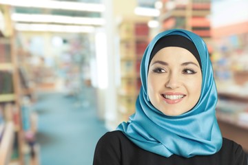 Young arabian woman on light background