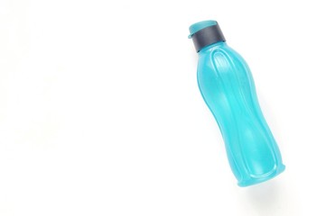 Eco bottle. Attributes of a healthy lifestyle: sports and athlete's equipment on white background. Flat view with copy space. Tool for fitness. Minimalism.