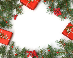 Christmas gift boxes decorated with craft paper and white snowflakes on red background top view. Merry christmas greeting card.