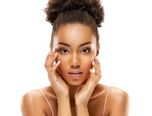 Attractive young african american girl touching her face on white background. Beauty & Skin care...